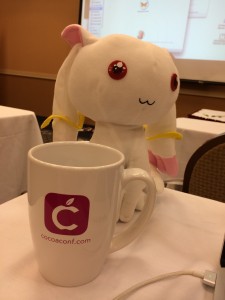 Kyubey posing with my special pink CocoaConf mug
